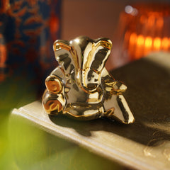 Gold Sitting Ceramic Ganesha Figurine