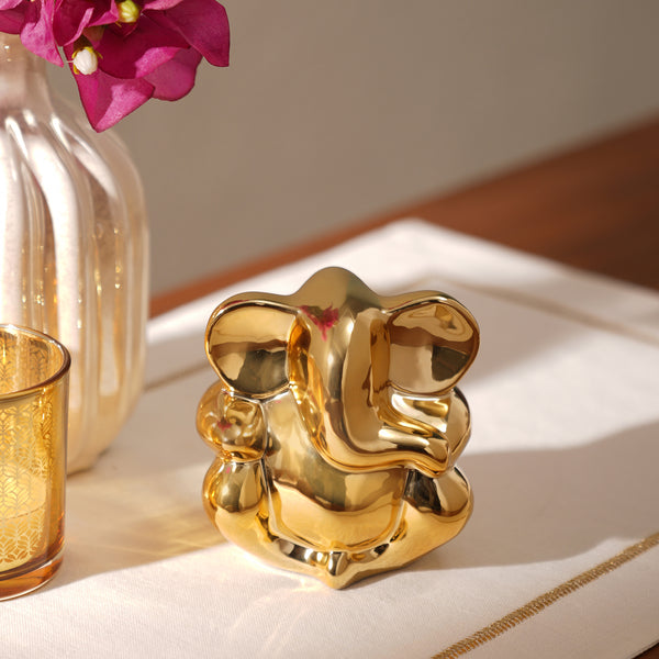 Gold Sitting Ceramic Ganesha Figurine