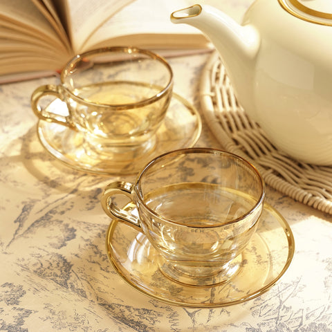 Set of 2 Light Gold Glass Gold Rim Tea Cups & Saucers