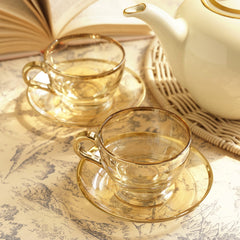Set of 2 Light Gold Glass Gold Rim Tea Cups & Saucers