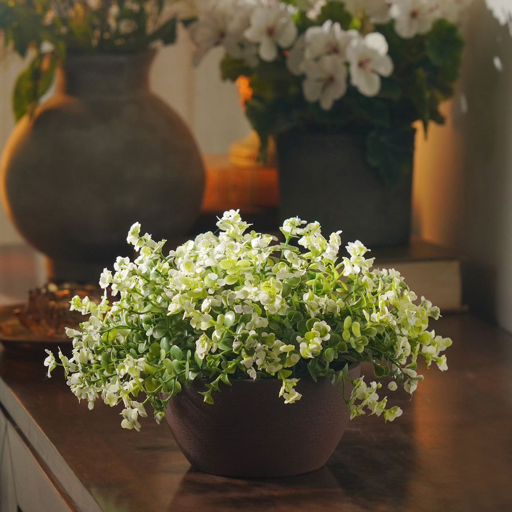 White Artificial Flowers in Paper Mache Pot